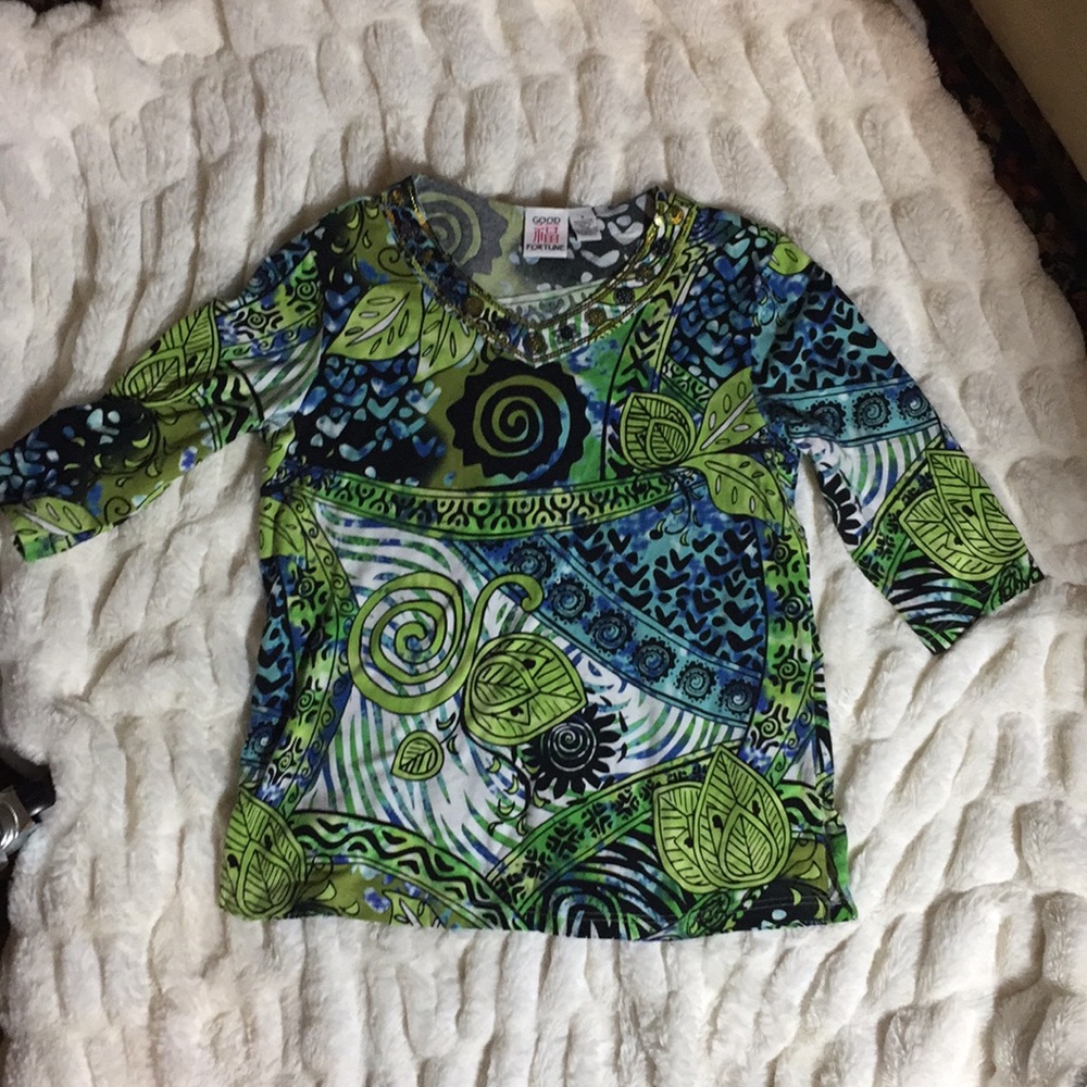 Good Fortune woman’s Top with embellishments .